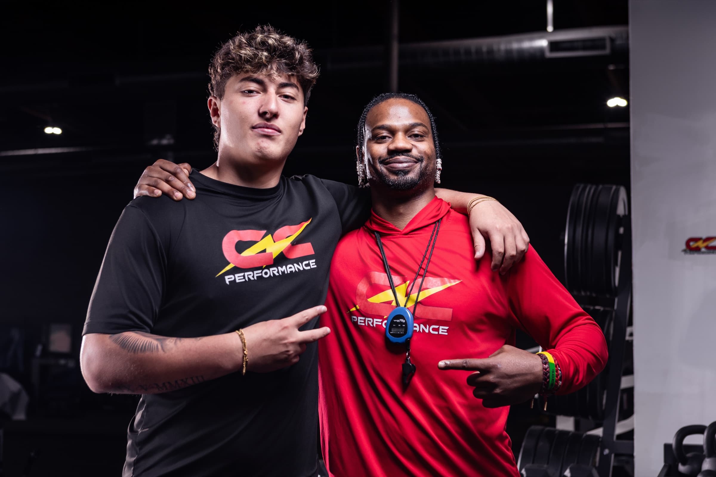 Coach Coop with an athlete at CNC Performance